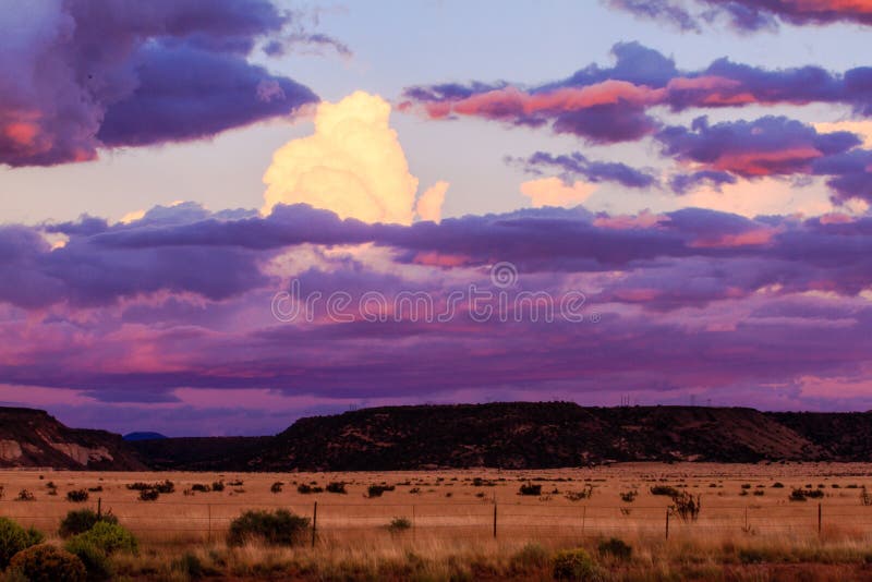 This image of a sunset over ranch land was captured in New Mexico not far from Santa Fe. This image of a sunset over ranch land was captured in New Mexico not far from Santa Fe.