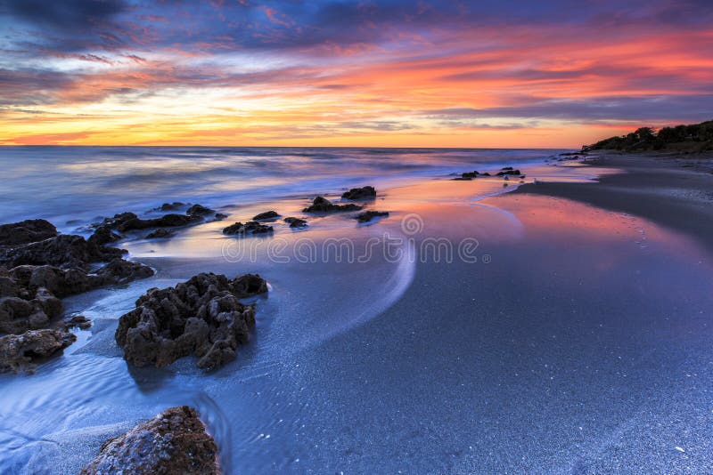 This sunset image of Casperson Beach in Venice, Florida was captured during the winter. This beach is a favorite for hunting petrified shark's teeth as well as for watching sunsets. This sunset image of Casperson Beach in Venice, Florida was captured during the winter. This beach is a favorite for hunting petrified shark's teeth as well as for watching sunsets.