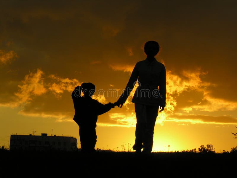 Mother with son sunset sky. Mother with son sunset sky