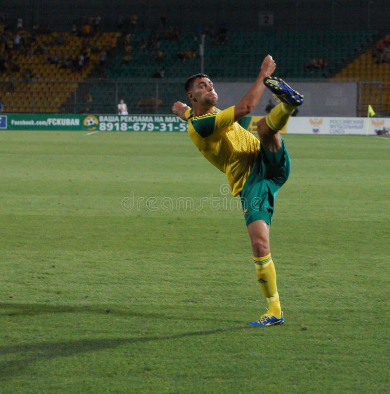 FC kuban defender Igor Armash hits the ball. FC kuban defender Igor Armash hits the ball