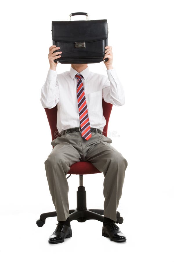 Portrait of shy businessman hiding his face behind briefcase. Portrait of shy businessman hiding his face behind briefcase