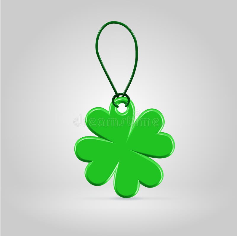 Green plastic shamrock leaf tag on a rope loop over green background. Green plastic shamrock leaf tag on a rope loop over green background