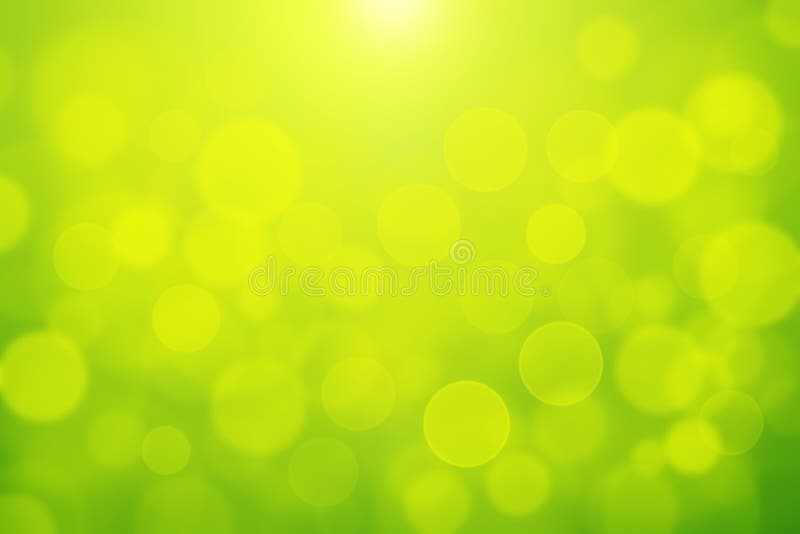 Зеленое bokeh предпосылки света конспекта bokeh blurly белое на желтой и зеленой предпосылке стоковое фото