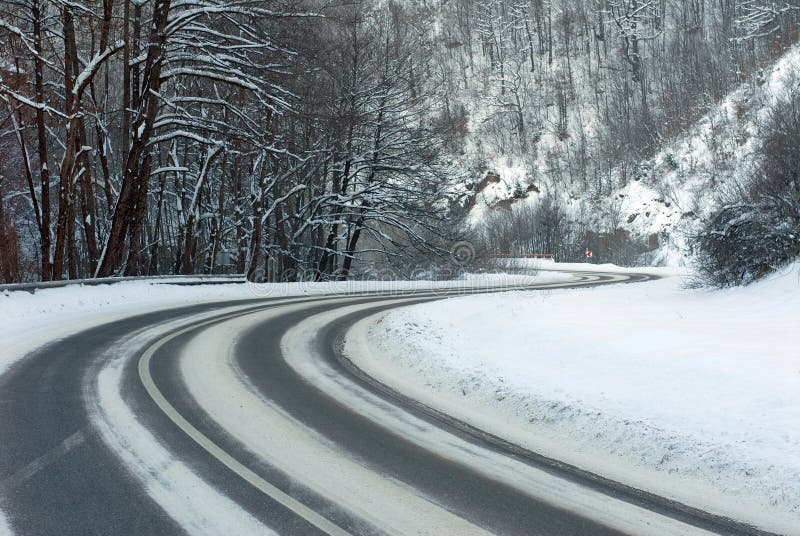 Snow covered trees lining road receding into distance, winter scene. Snow covered trees lining road receding into distance, winter scene.