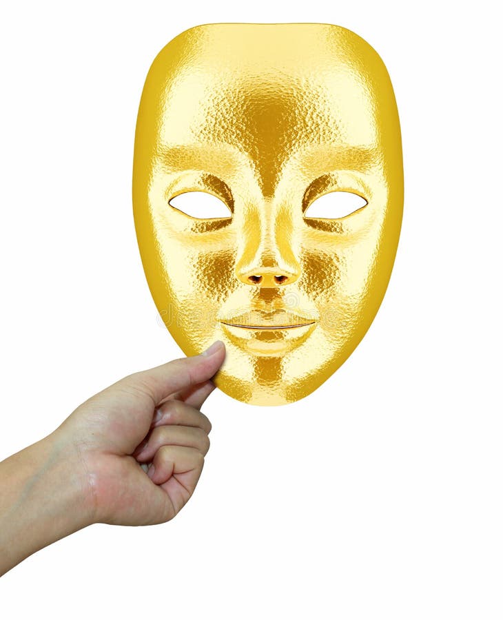 A golden face mask in hand isolated on white background. A golden face mask in hand isolated on white background.