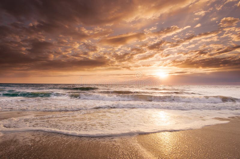 This golden Florida East Coast Sunrise reflects the tropical beauty of the region. This golden Florida East Coast Sunrise reflects the tropical beauty of the region.