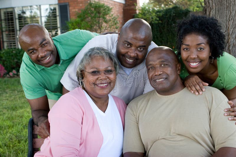 Happy African American couple and their adult kids. Happy African American couple and their adult kids.
