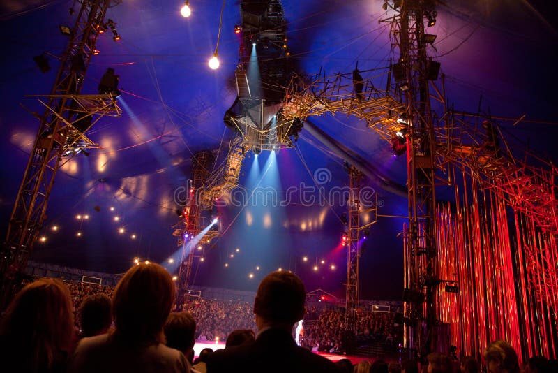 MOSCOW - OCTOBER 23: Spectators watch representation of Cirque du Soleil October 23, 2009 in Moscow, Russia. MOSCOW - OCTOBER 23: Spectators watch representation of Cirque du Soleil October 23, 2009 in Moscow, Russia.