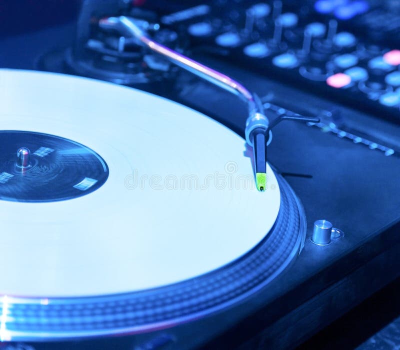 Vinyl record player in nightclub closeup. Vinyl record player in nightclub closeup