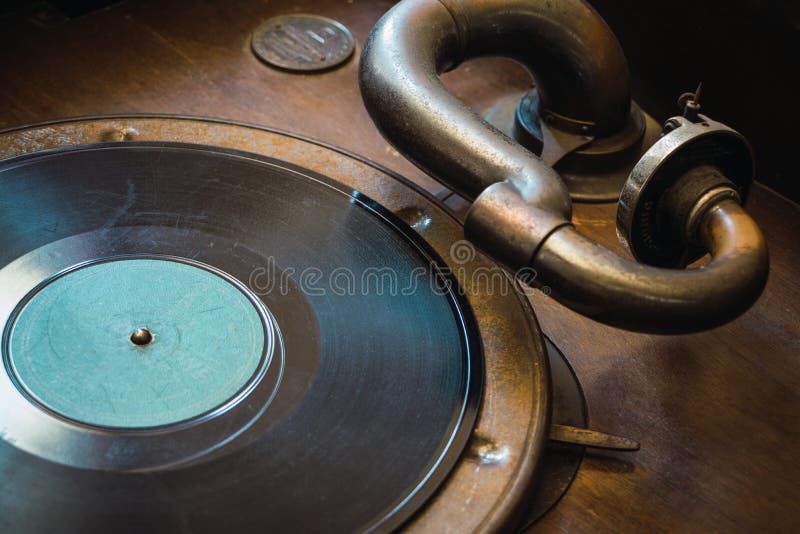 Detail of 1920`s old manual analog vinyl record player and disc. Detail of 1920`s old manual analog vinyl record player and disc