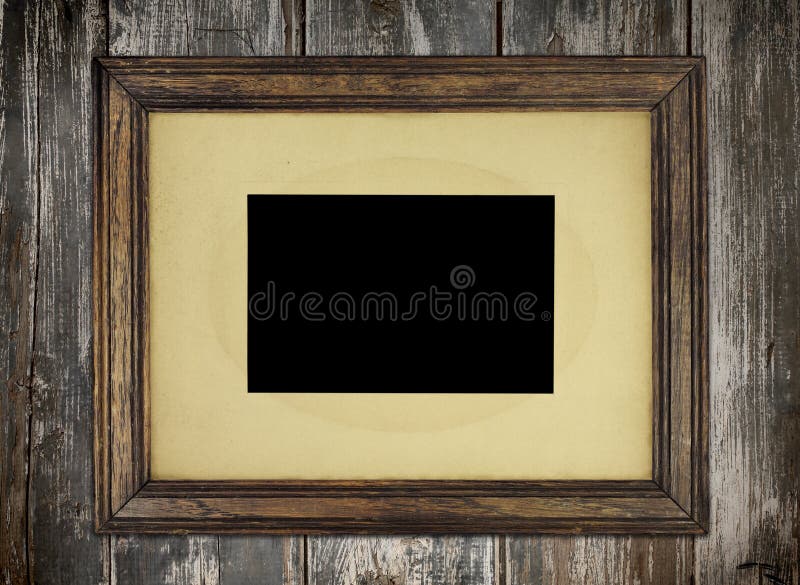 Old wooden picture frame on wooden wall. Old wooden picture frame on wooden wall