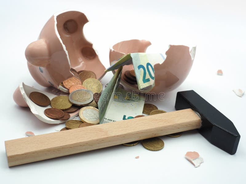 Image of a broken piggy bank with savings. Image of a broken piggy bank with savings.