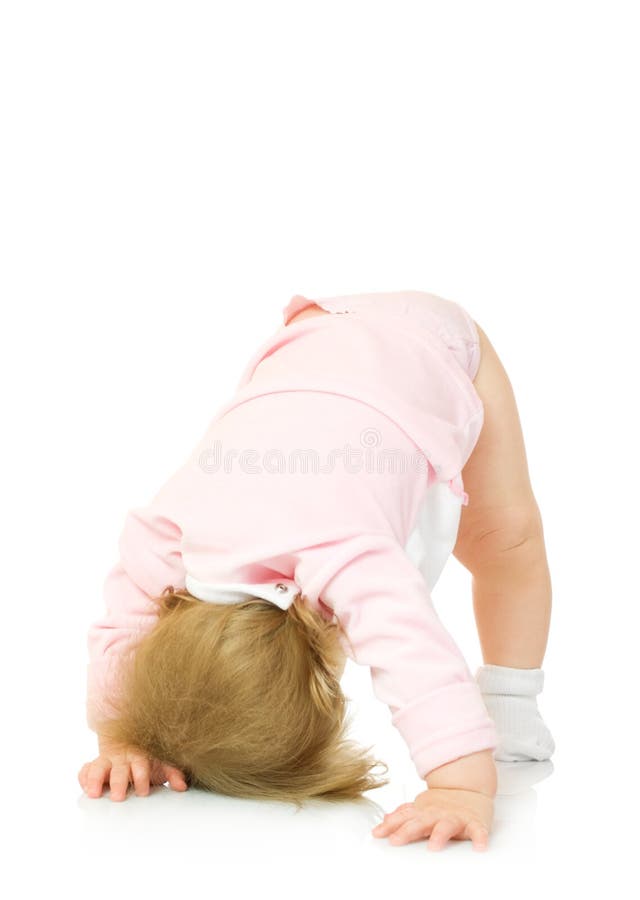 Small girl makes gymnastic exercise isolated on white. Small girl makes gymnastic exercise isolated on white