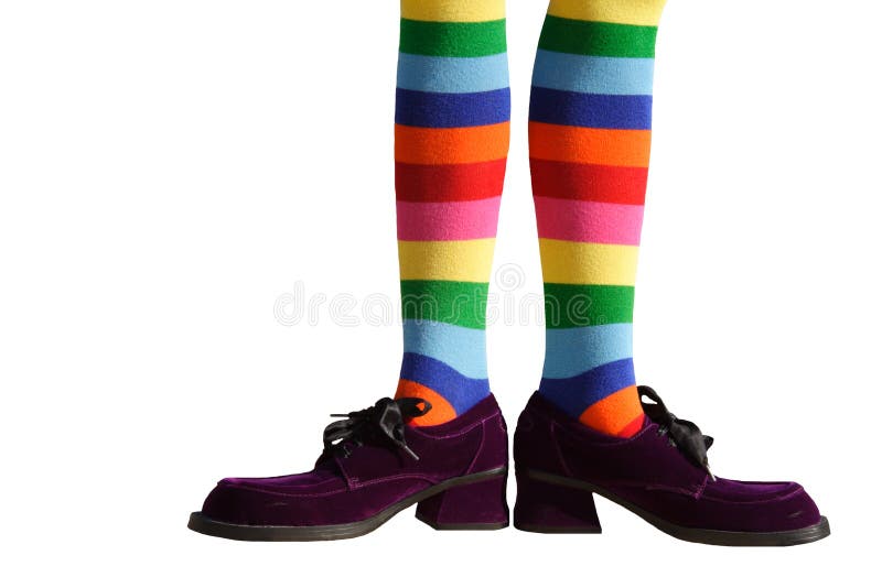 Wacky clown feet with crazy striped socks and oversized purple suede shoes! Isolated. Wacky clown feet with crazy striped socks and oversized purple suede shoes! Isolated.