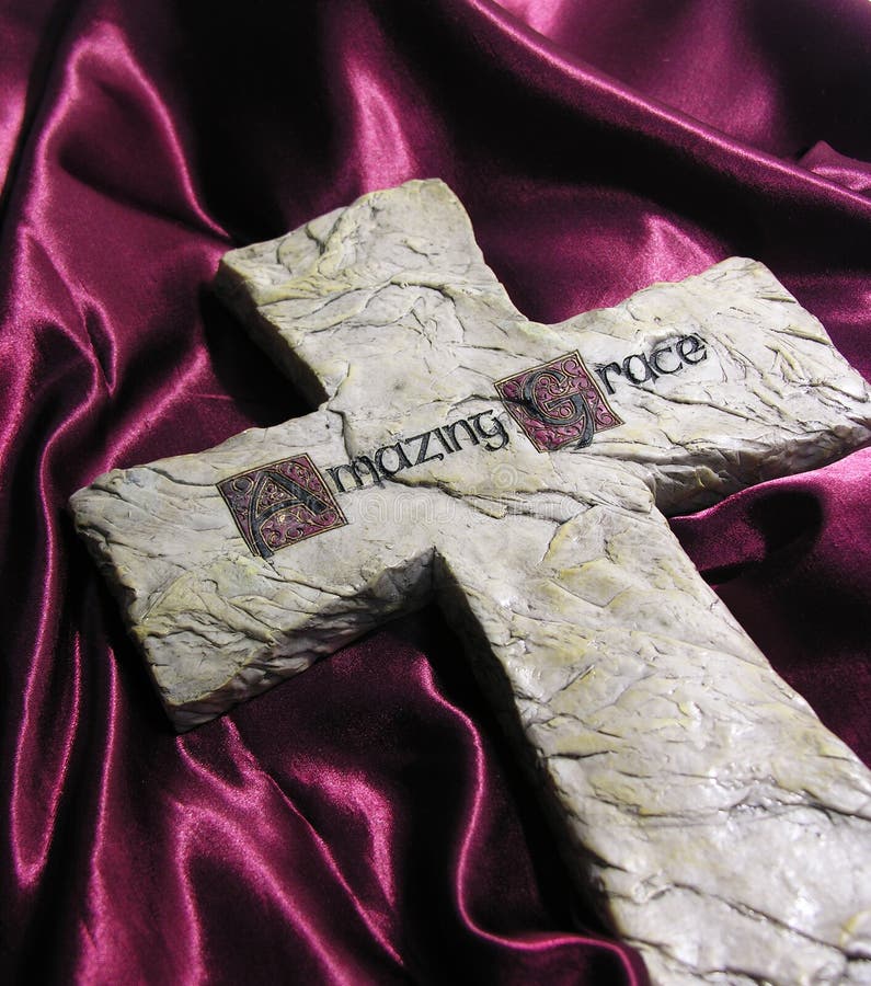 A photo of a cross on velvet. A photo of a cross on velvet