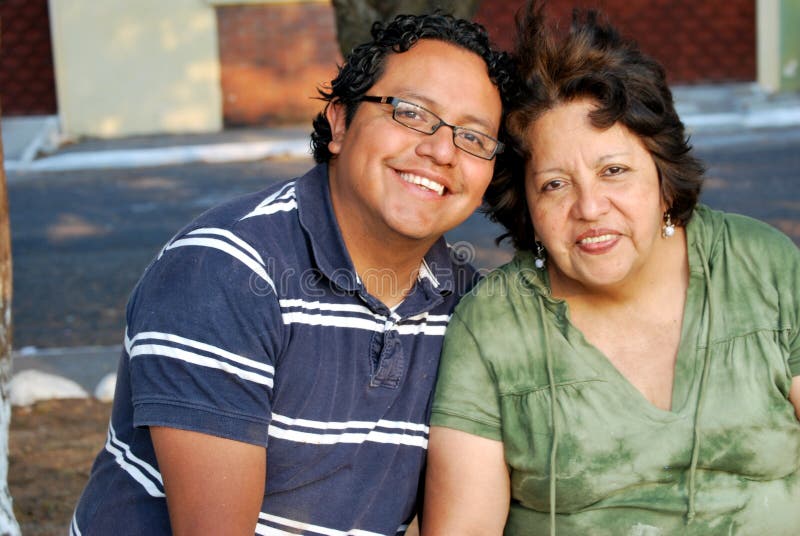 Hispanic Mother and son sitting together. Hispanic Mother and son sitting together.