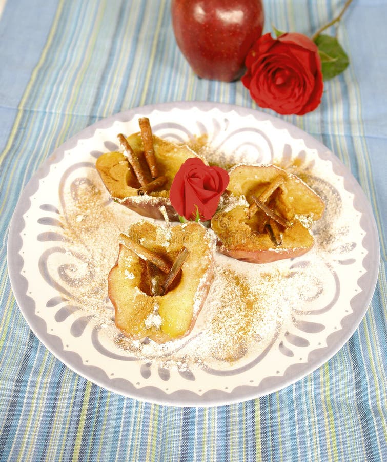 Baked apples with cinnamon and rose decoration. Baked apples with cinnamon and rose decoration