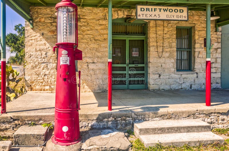 Front entrance to historic general store in Driftwood, Texas with red, antique gas pump. Front entrance to historic general store in Driftwood, Texas with red, antique gas pump.