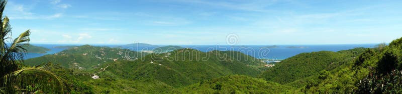 Panoramic view of forested hills with Caribbean sea in background. Panoramic view of forested hills with Caribbean sea in background.