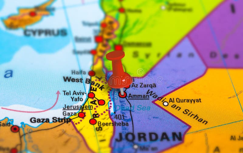 Amman in Jordan pinned on colorful political map of Middle East. Geopolitical school atlas. Tilt shift effect. Amman in Jordan pinned on colorful political map of Middle East. Geopolitical school atlas. Tilt shift effect.