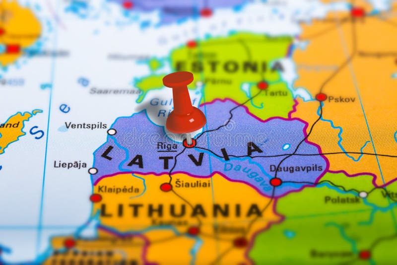 Riga Latvia pinned on colorful political map of Europe. Geopolitical school atlas. Tilt shift effect. Riga Latvia pinned on colorful political map of Europe. Geopolitical school atlas. Tilt shift effect.