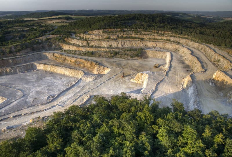 Limestone opencast in a forested landscape, Czech. Limestone opencast in a forested landscape, Czech.