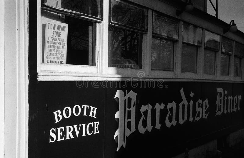 The vintage Paradise Diner on Bridge St., the home of the Boott Mill Sandwich in Lowell, Massachusetts. The image was captured on analog black and white film. The vintage Paradise Diner on Bridge St., the home of the Boott Mill Sandwich in Lowell, Massachusetts. The image was captured on analog black and white film