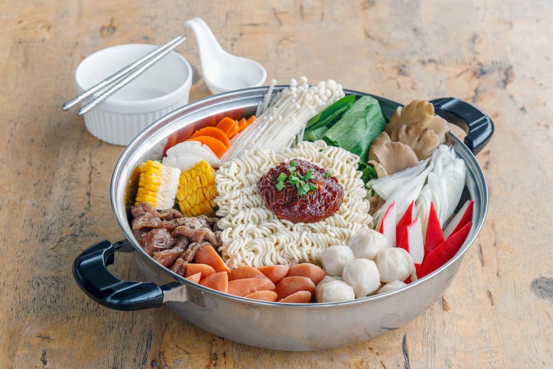 Set of Sukiyaki, Shabu with noodle and vegetable in the pot on wooden table. Set of Sukiyaki, Shabu with noodle and vegetable in the pot on wooden table