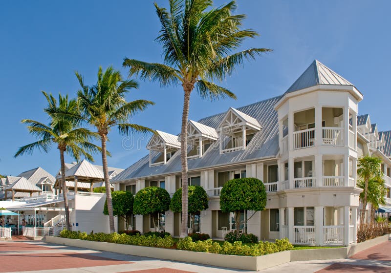 Exterior of condominium buildings with palm trees in foreground, Key West, Florida. Exterior of condominium buildings with palm trees in foreground, Key West, Florida.