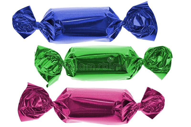 Three colorful candies in blue, green and pink. Three colorful candies in blue, green and pink.
