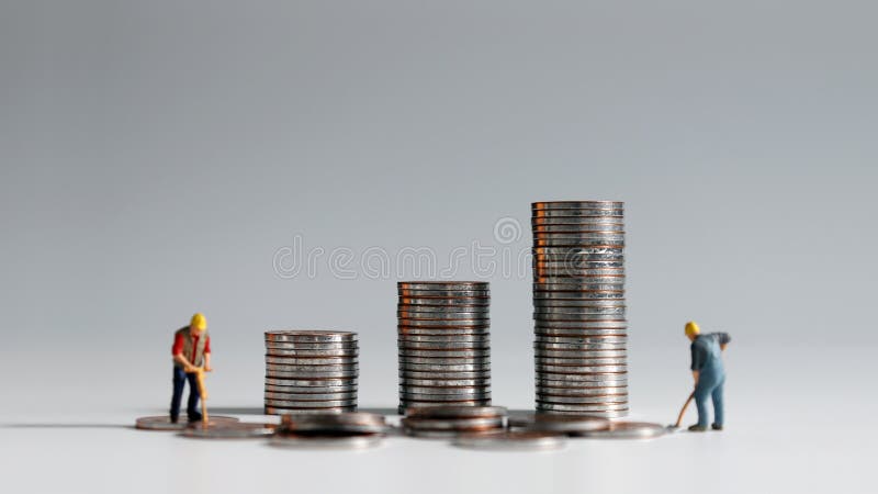 Concept of rising labor costs. AÂ stackÂ ofÂ coinsÂ andÂ twoÂ miniatureÂ people. Concept of rising labor costs. AÂ stackÂ ofÂ coinsÂ andÂ twoÂ miniatureÂ people.