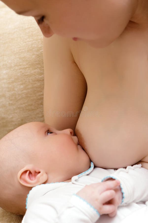 Young mother breast feeding her little son. Young mother breast feeding her little son