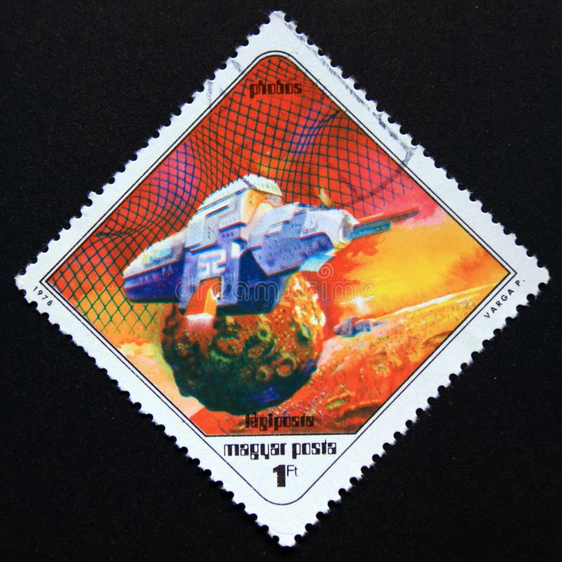 Post stamp printed in magyar, hungary, 1978. Spaceship near phobos. Value 1 hungarian forint. From the series science fiction paintings by pal varga. Post stamp printed in magyar, hungary, 1978. Spaceship near phobos. Value 1 hungarian forint. From the series science fiction paintings by pal varga.