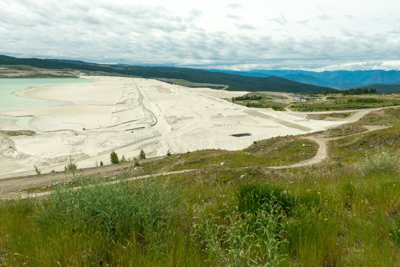 The edge of a tailings pond at a copper mine in British Columbia, Canada. The edge of a tailings pond at a copper mine in British Columbia, Canada