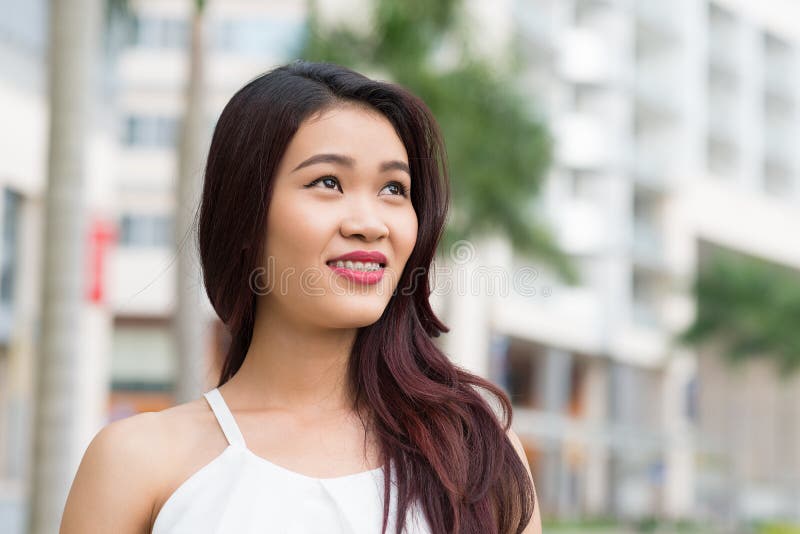 Portrait of young beautiful Vietnamese woman wearing braces. Portrait of young beautiful Vietnamese woman wearing braces