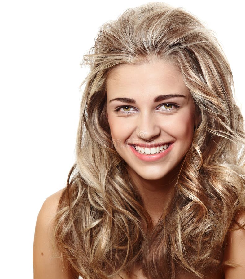 Beautiful natural make-up woman with blond long hair in curly hairstyle smiling at camera. Beautiful natural make-up woman with blond long hair in curly hairstyle smiling at camera