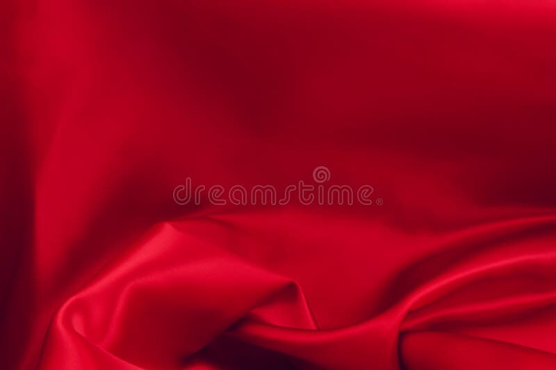 Piece of luxurious red satin fabric suitable for a textured background. Piece of luxurious red satin fabric suitable for a textured background
