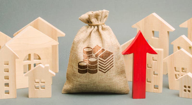 Red arrow up, money bag and miniature wooden houses. The concept of rising property prices. High mortgage rates. Expensive rental apartment. Growing demand for home purchase. Real estate market. Red arrow up, money bag and miniature wooden houses. The concept of rising property prices. High mortgage rates. Expensive rental apartment. Growing demand for home purchase. Real estate market