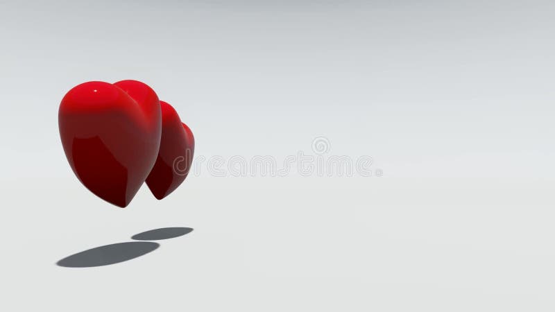 2 красных вращая сердца на белой предпосылке