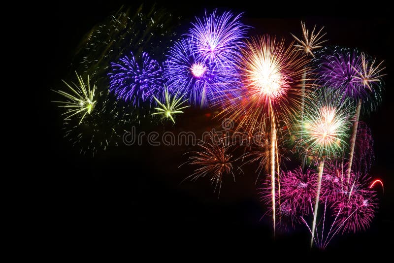 Colorful fireworks overlapping many black backgrounds. copy space. Colorful fireworks overlapping many black backgrounds. copy space