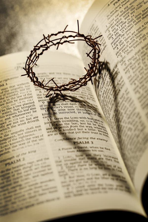 The crown of thorns casting a heart shaped shadow on the Holy Bible. The crown of thorns casting a heart shaped shadow on the Holy Bible.