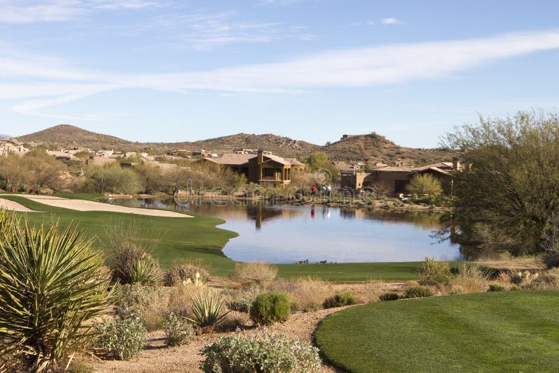 Scenic desert landscape at Arizona golf course with luxury homes, cactus, native bushes, mountains and rocks. Scenic desert landscape at Arizona golf course with luxury homes, cactus, native bushes, mountains and rocks.