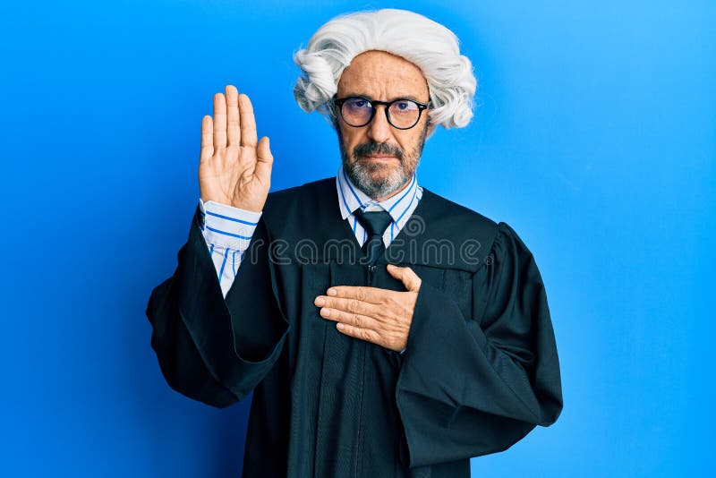 Middle age hispanic man using gavel relaxed with serious expression on face. simple and natural looking at the camera. Middle age hispanic man using gavel relaxed with serious expression on face. simple and natural looking at the camera