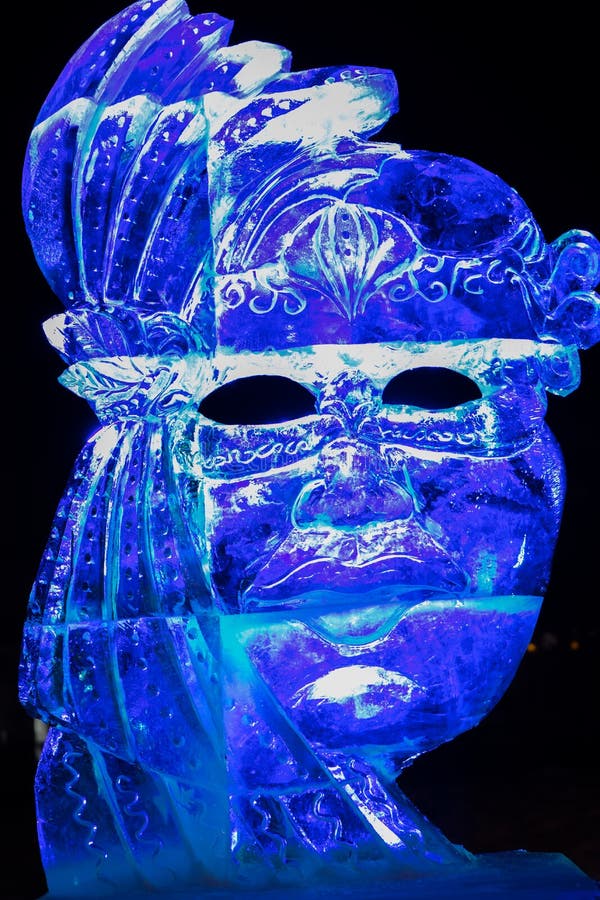 Ice sculpture in Ski resort Bad Gastein, Austria. Photo of woman statue made from ice and lightened with different colored lamps. Ice sculpture in Ski resort Bad Gastein, Austria. Photo of woman statue made from ice and lightened with different colored lamps