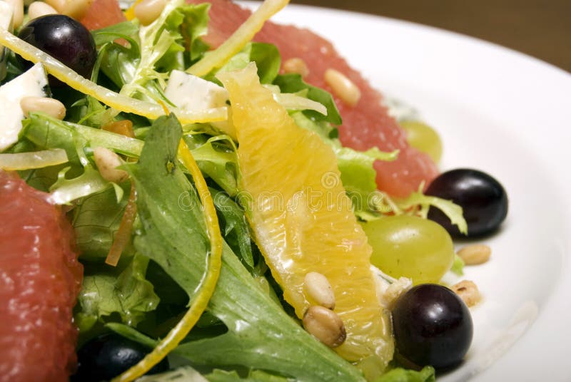 Salad made of citrus, grape and cheese. Salad made of citrus, grape and cheese