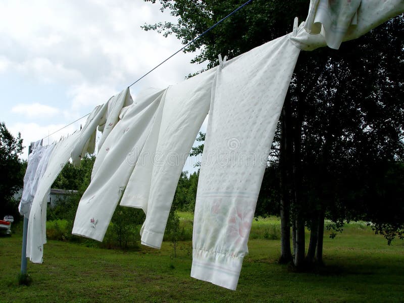 Sheets on the clothes line, in the summer. Sheets on the clothes line, in the summer
