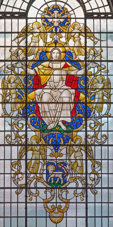 LONDON, GREAT BRITAIN - SEPTEMBER 17, 2017: The Jesus Christ in glory on the stained glass in St James`s Church, Piccadilly by Christopher Webb 1954. LONDON, GREAT BRITAIN - SEPTEMBER 17, 2017: The Jesus Christ in glory on the stained glass in St James`s Church, Piccadilly by Christopher Webb 1954.