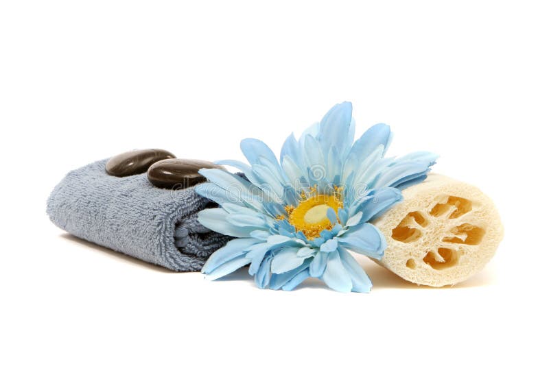 Spa towel, loofah, flower and rocks isolated on white background. Spa towel, loofah, flower and rocks isolated on white background