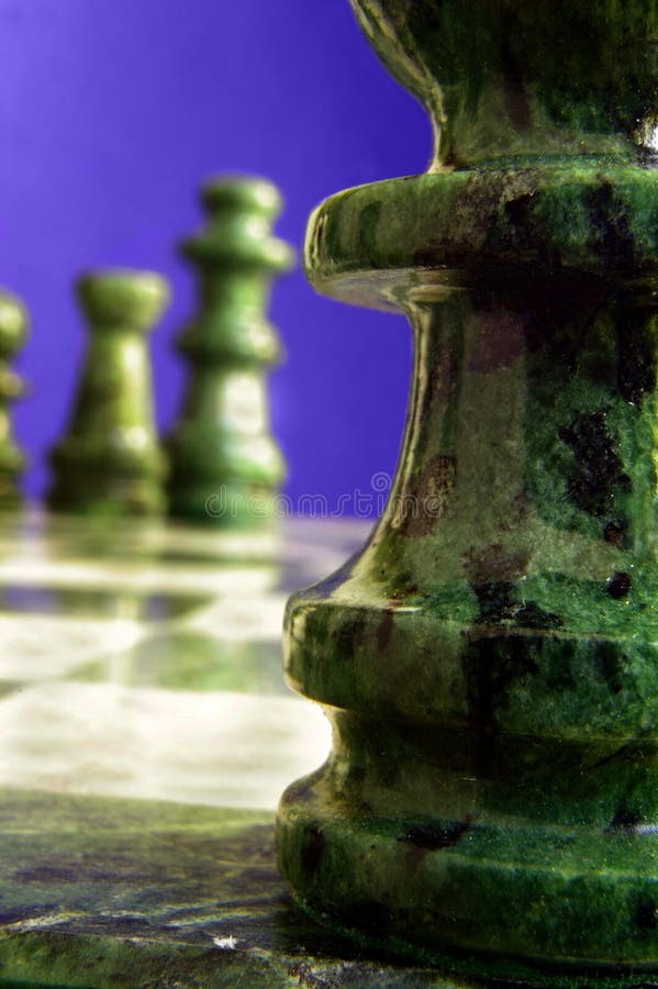 Chess pieces near and far, on purple background. Chess pieces near and far, on purple background