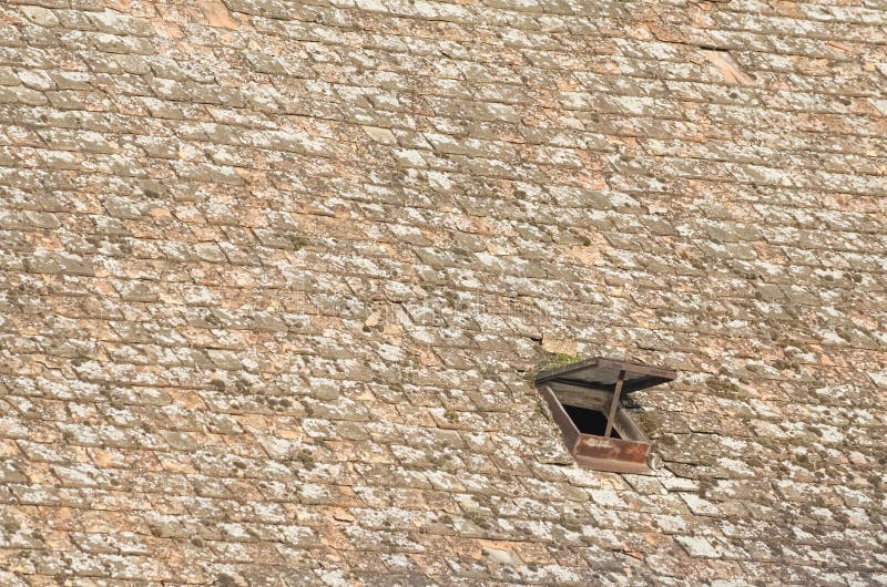 Small Roof Window on the Textured Roof. Small Roof Window on the Textured Roof